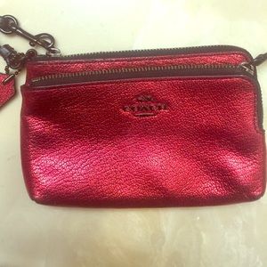 Metallic red Coach wristlet